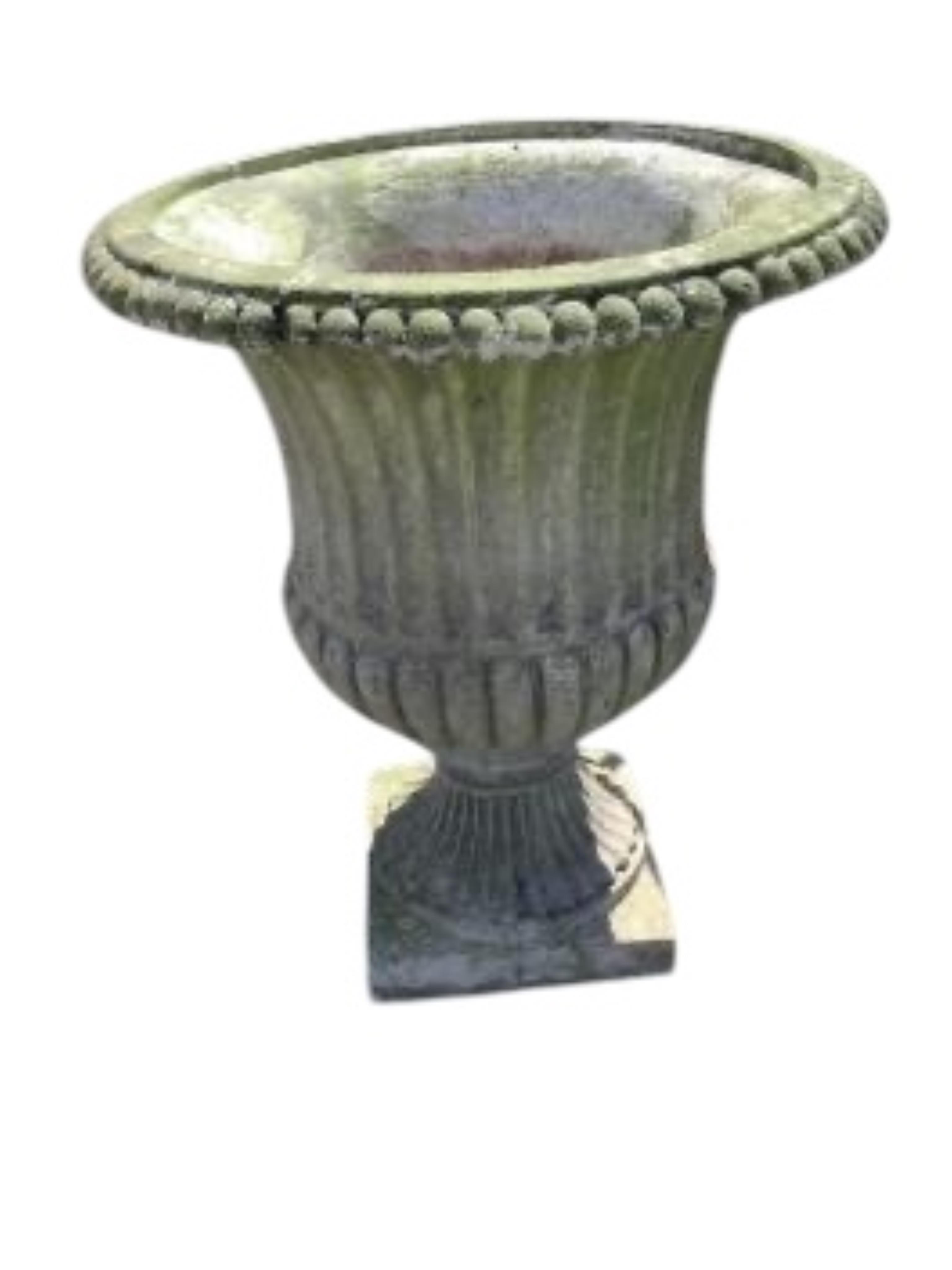 A pair of reconstituted stone campana garden urns on pedestal bases, diameter 46cm, height 58cm